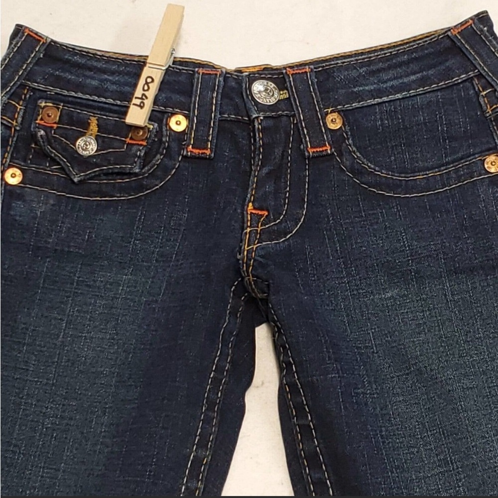 Reselling these size 24 True Religion jeans.